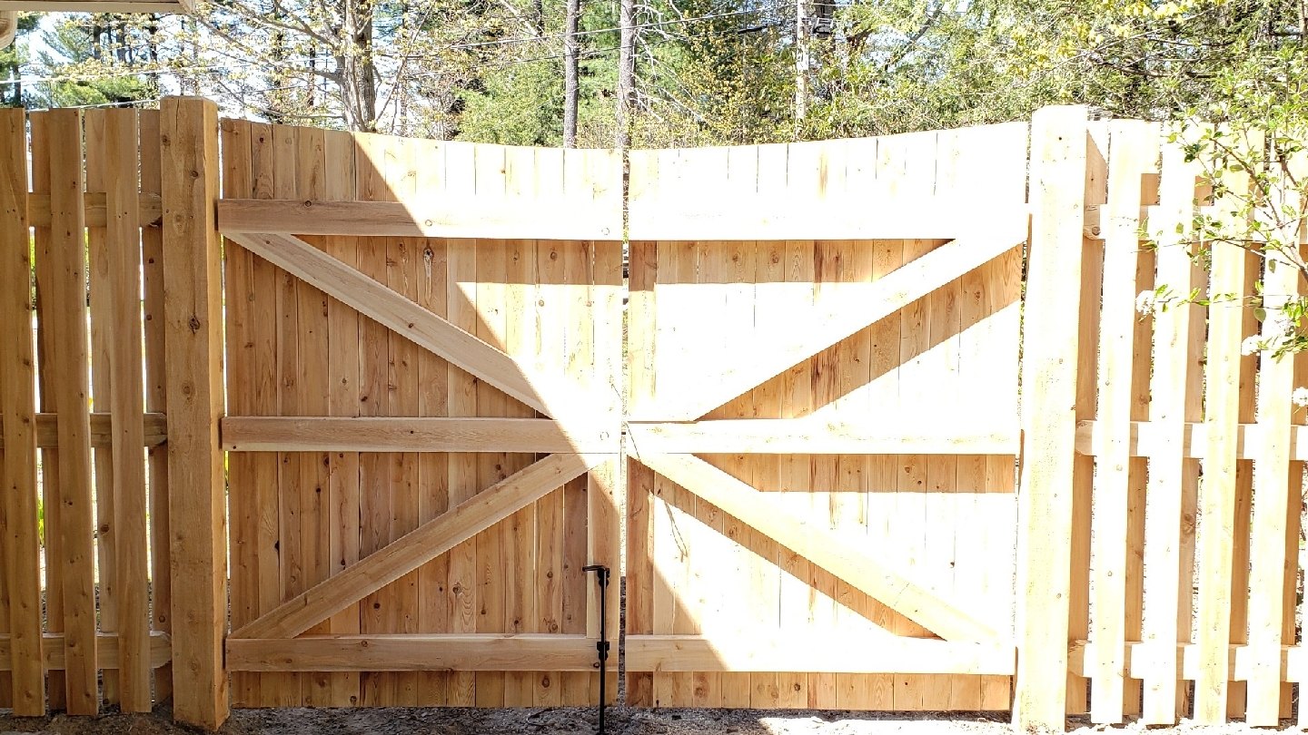 Cedar double gate with cross bracing built by Sullivan & Sons Fence